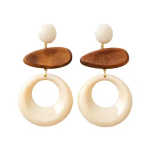 Elegant vintage geometric drop earrings featuring wood and white resin on a white background