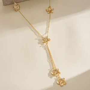 Detailed view of the vintage gold flower tassel necklace showing intricate petal textures