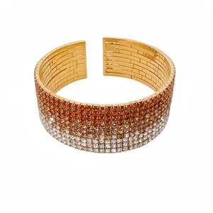 Bracciale rigido dorato a più strati con pavé di strass sfumati arancio-bianco