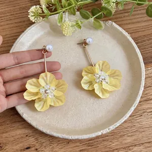 Sweet holiday style yellow flower drop earrings with pearl studs and gold-tone finish