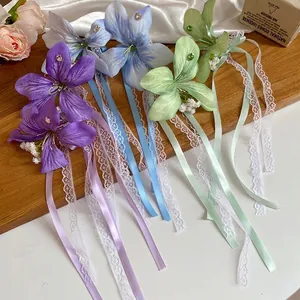 Barrettes à fleurs élégantes avec rubans en dentelle et strass en violet bleu et vert