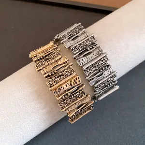 Retro gold and silver metal bracelets with irregular geometric textured fashion design
