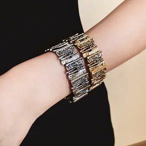 Detailed view of retro irregular textured metal bracelets in gold and silver finish