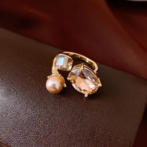 Elegant oval crystal and pearl open ring with champagne tones for sophisticated women