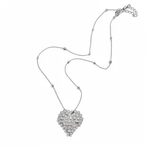 Elegant silver heart pendant necklace with pavé stones and bead accents