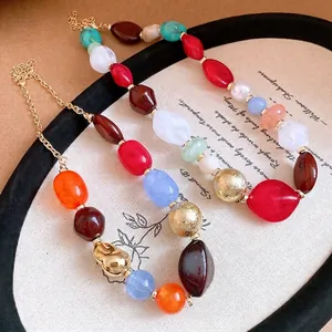 Bohemian multi-color irregular resin beaded necklace featuring an elegant gold-plated chain