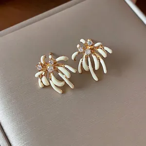 Elegant 18k gold plated firework stud earrings with white enamel and zircons