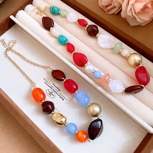 Close-up detail of Bohemian colorful irregular resin bead necklace presented in a jewelry box