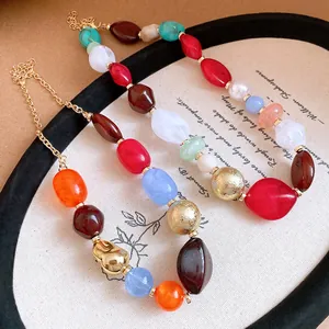 Detailed close-up of a colorful irregular resin bead necklace with bohemian vintage style