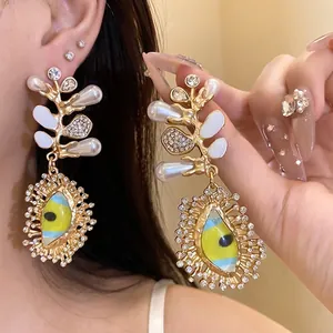 Luxury ornate drop earrings with pearls, rhinestones and enamel eye design for summer style