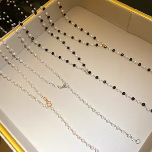 Detail view of various elegant beaded pearl necklaces in a luxury display tray
