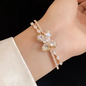 Close-up detail of a double-layered open bangle with a zircon butterfly design