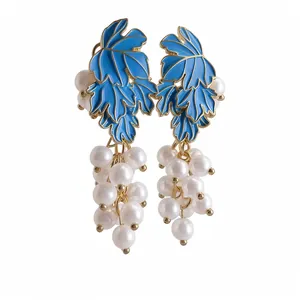 Elegant vintage blue leaf earrings featuring white pearl grape cluster pendants on gold