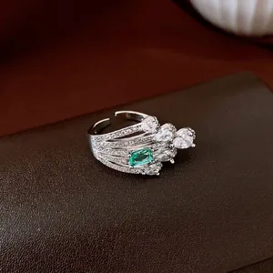 Vintage emerald green zircon adjustable ring with sparkling crystal details.