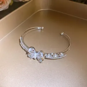 Detail view of zircon butterfly double-layer open cuff bracelet with crystal stones
