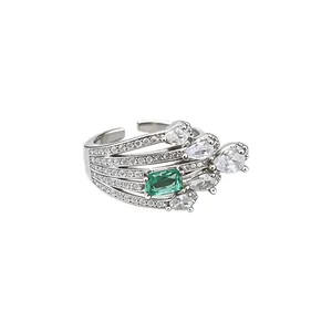 Vintage style silver open ring with emerald green gemstone and sparkling zircons