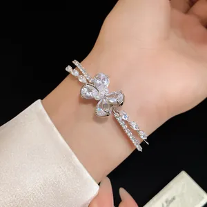 Close-up detail of exquisite double-layer zircon butterfly open bracelet on wrist