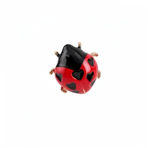 Adjustable gold-plated ladybug open ring featuring red enamel and black heart spots