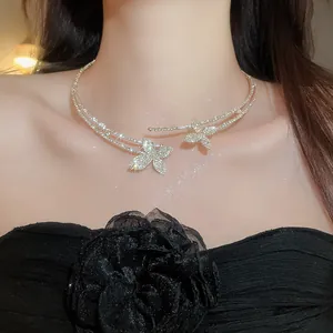 Close-up of a luxurious double-layered gold choker with sparkling diamond flowers.