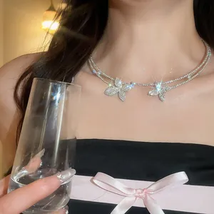 Elegant double-layer silver-toned necklace with sparkling rhinestone flower pendants