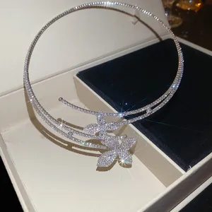 Detailed view of a double-layered choker featuring two rhinestone-encrusted flowers.