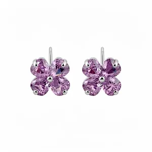 Professional shot of silver four-leaf clover stud earrings with purple zircon