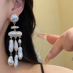 Detail view of baroque pearl tassel earrings showing vintage elegance and pearl luster