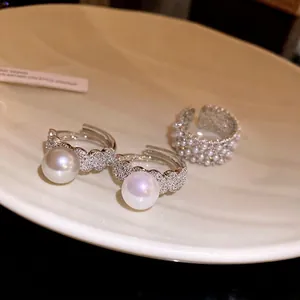 Elegant zircon pearl open rings for women featuring luxurious and minimalist designer style