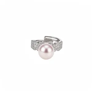 Elegant open ring with pink pearl and zircon accents on a silver-tone band
