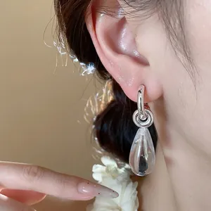 Minimalist silver needle C-shaped resin teardrop earrings with high-end luxury feel