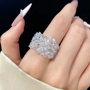 Close-up view of an elegant multi-strand clear faceted zircon wrap ring on a model hand.
