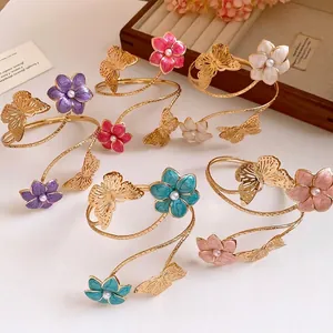 Elegant metal enamel flower and butterfly arm rings with pearl centers for women