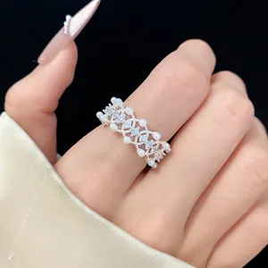 Close-up of a sophisticated hollow silver ring adorned with pearls and cubic zirconia