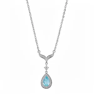 Elegant silver necklace with blue teardrop pendant and zirconia fishtail design