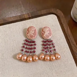 Elegant vintage cameo pearl tassel earrings with burgundy beads and gold teardrop pendants