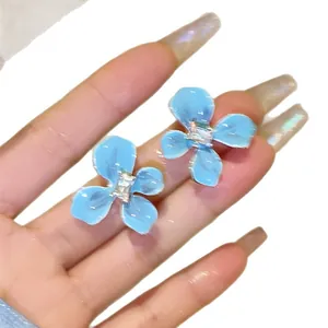 Elegant sea salt blue flower stud earrings with sparkling cubic zirconia for women