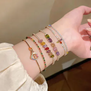 Close-up detail of luxury colorful zircon bracelet set including heart and oval stone designs