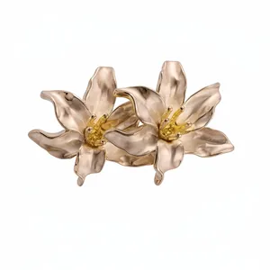 Elegant vintage-style double lily flower stud earrings with a matte gold and yellow finish