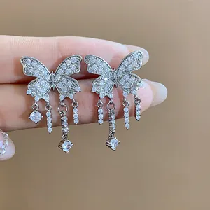 Detailed view of sparkling zircon butterfly tassel clip-on earrings for non-pierced ears