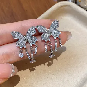 Detailed close-up of exquisite silver zircon butterfly tassel ear clips for non-pierced ears