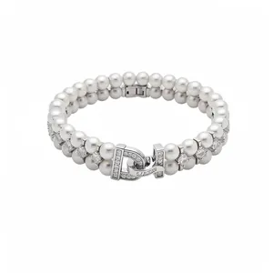 Elegant French vintage double-strand pearl bracelet featuring a sparkling zircon D-shaped clasp