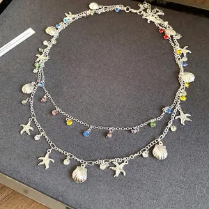 Collier double rang en argent avec strass colorés et breloques étoile de mer et coquillage