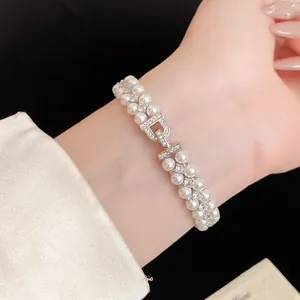 Close-up of double-strand pearl bracelet with zircon encrusted D-shaped clasp