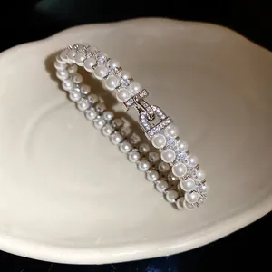 Exquisite double-layer pearl bracelet with sparkling zirconia and decorative clasp