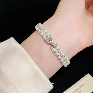 Detailed view of elegant vintage double-layer pearl bracelet with zircon D-shaped clasp