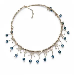Elegant gold choker necklace with blue bead fringe and intricate lace design for women