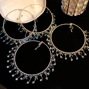 Macro detail of vintage gold and silver lace fringe chokers with blue and clear beads