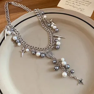 Elegant double-layered necklace with mixed pearls, star charms and oval medal pendant