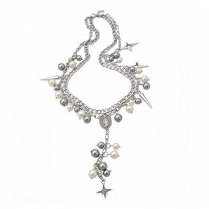 Elegant double-layered silver necklace featuring grey and white pearls with star charms.