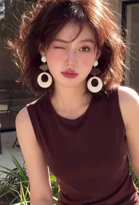 Detail showing retro French hollow acrylic and wooden earrings on an Asian model.